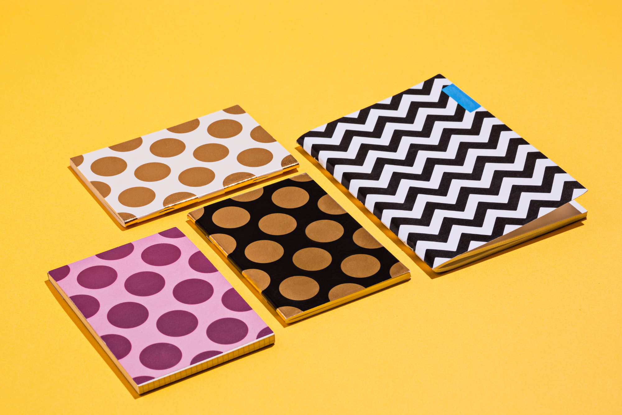 the-many-notebooks-on-colored-table-memo-and-plann-PNWQVD5.jpg